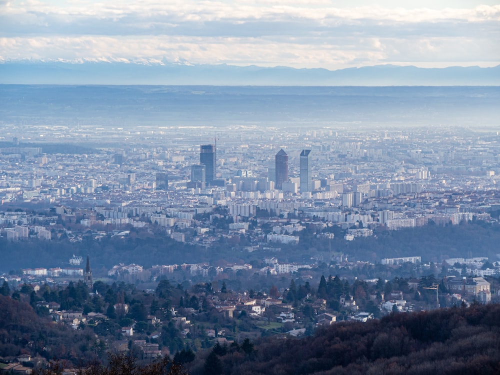 a view of a city from the top of a hill