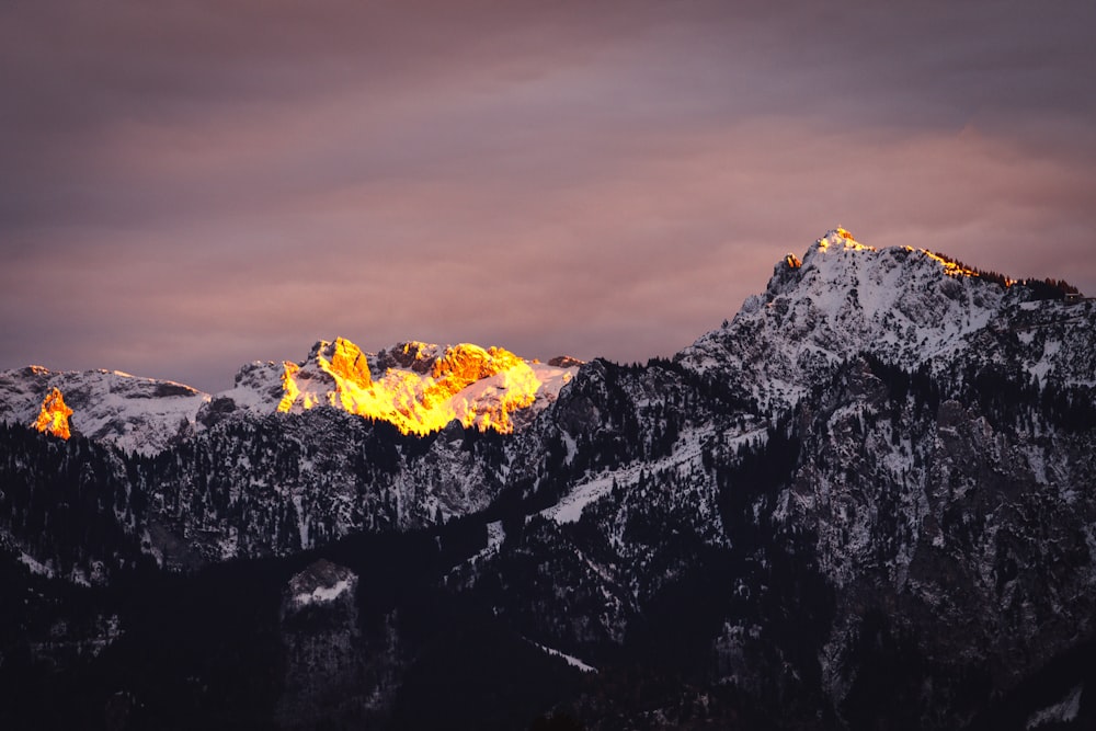 a view of a mountain range at sunset