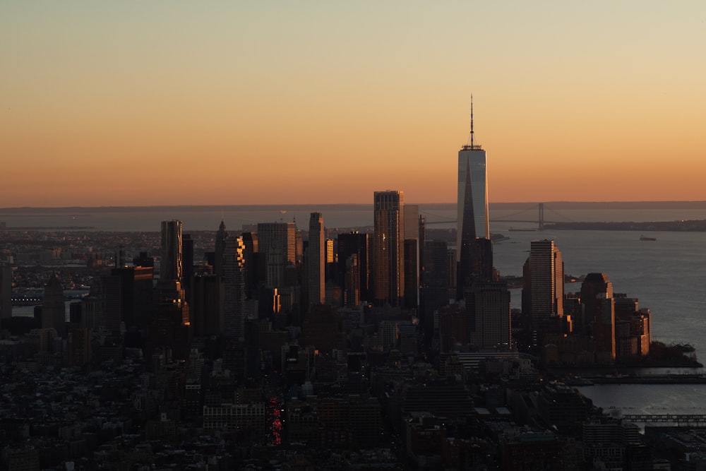 a view of a city skyline at sunset