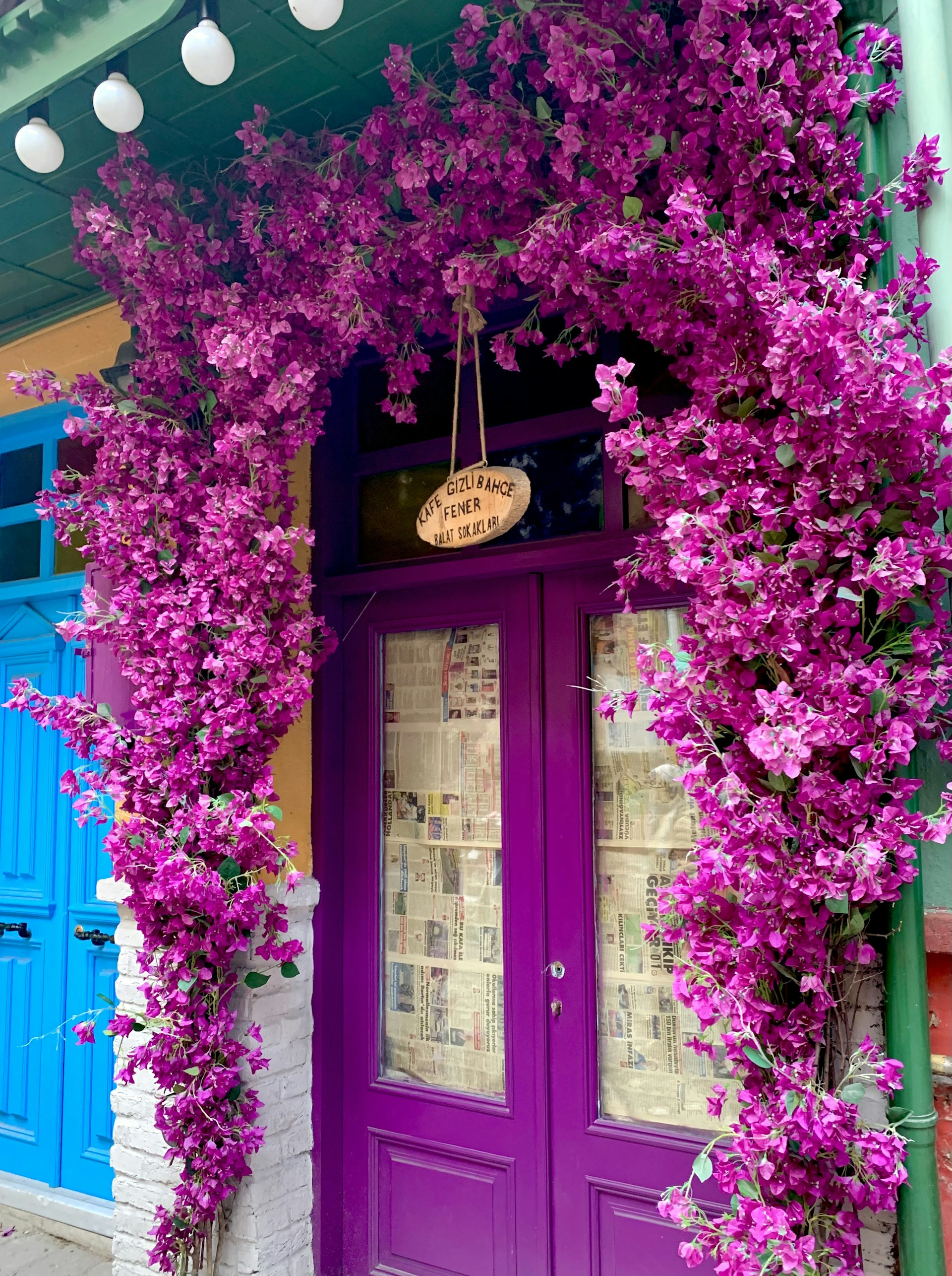 woman wearing yellow long-sleeved dress under white clouds and blue sky during daytime