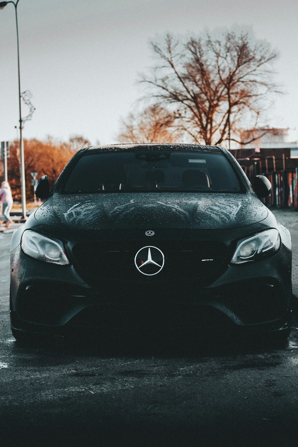 a black car parked in a parking lot