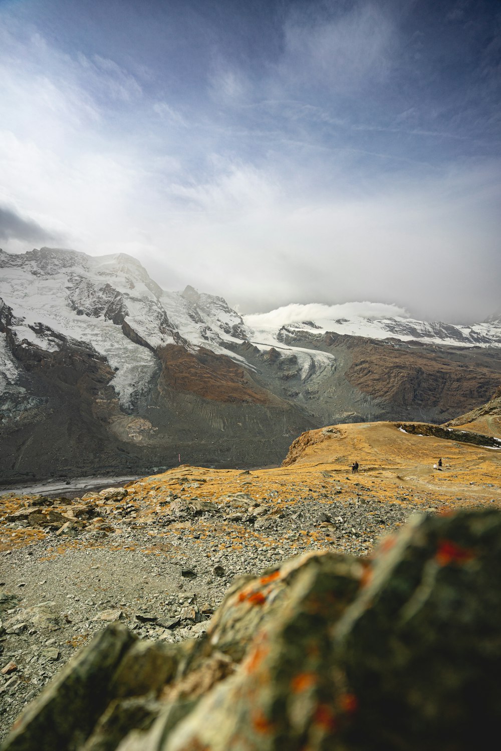 a view of a mountain range with snow on the top