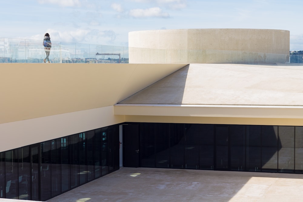 a person standing on the roof of a building