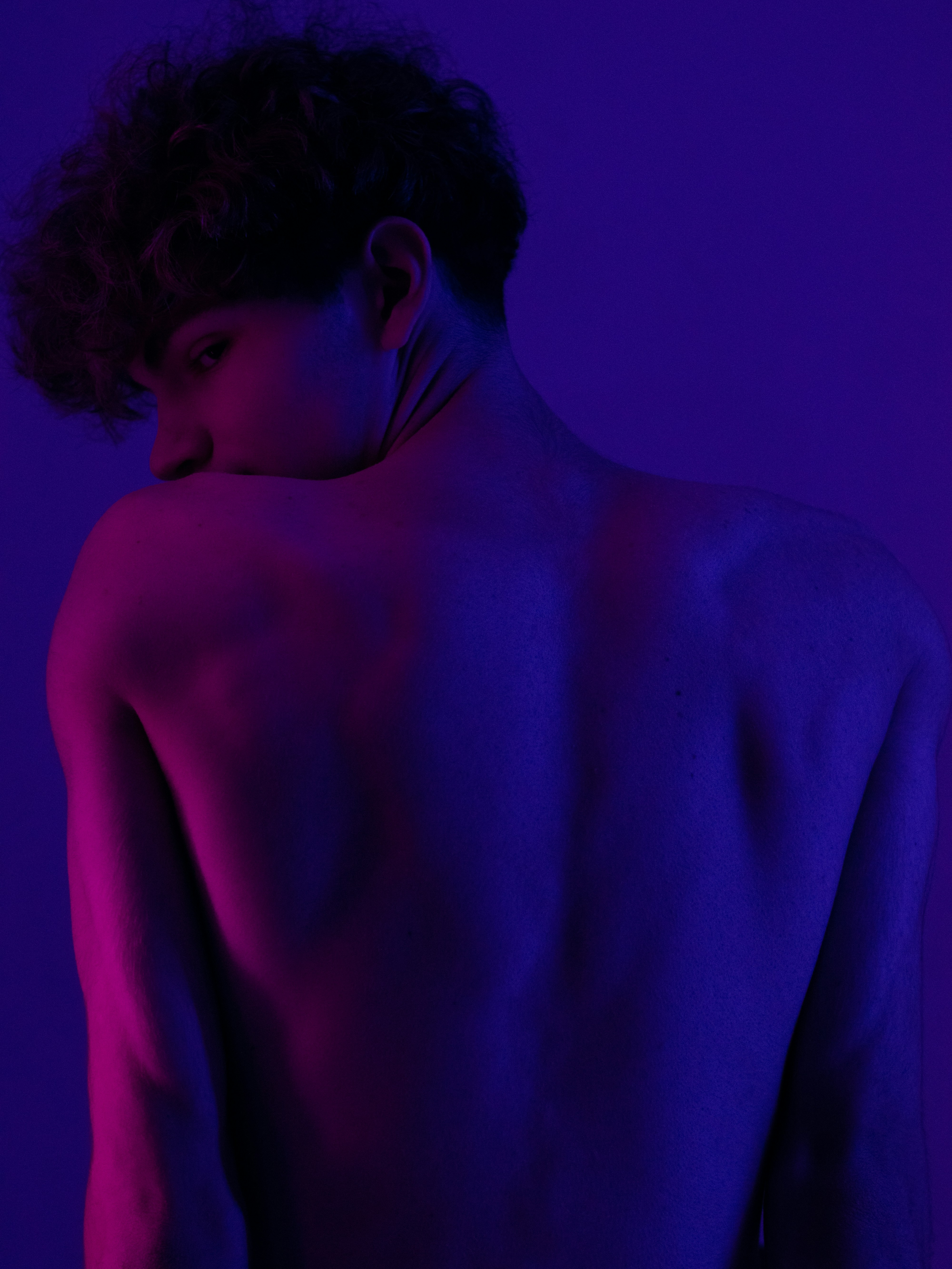 A man with his back turned to the camera