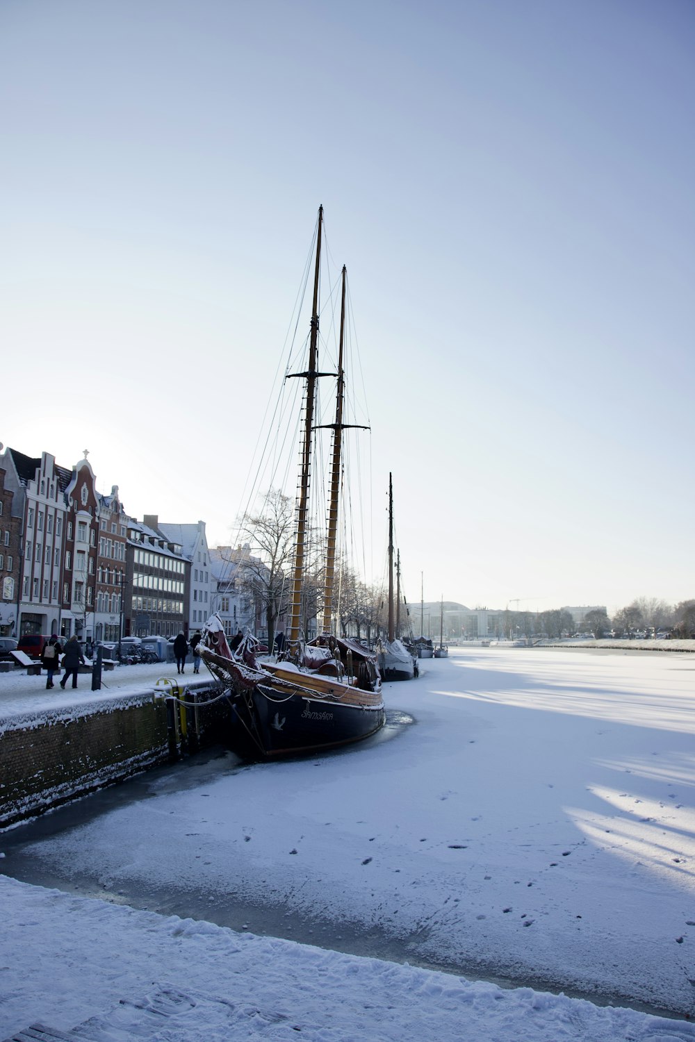 a couple of boats that are sitting in the snow