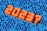 Large, bold orange numbers and a question mark in 3D text appear to rise from a complex blue maze, suggesting uncertainty or questioning related to the year 2023.