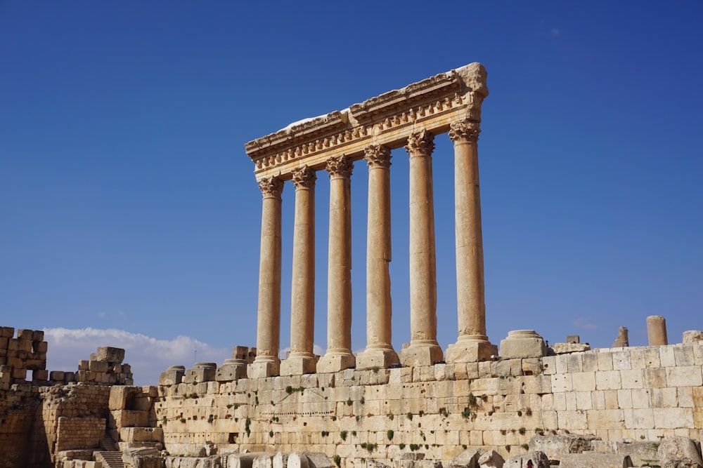 a large stone structure with four pillars