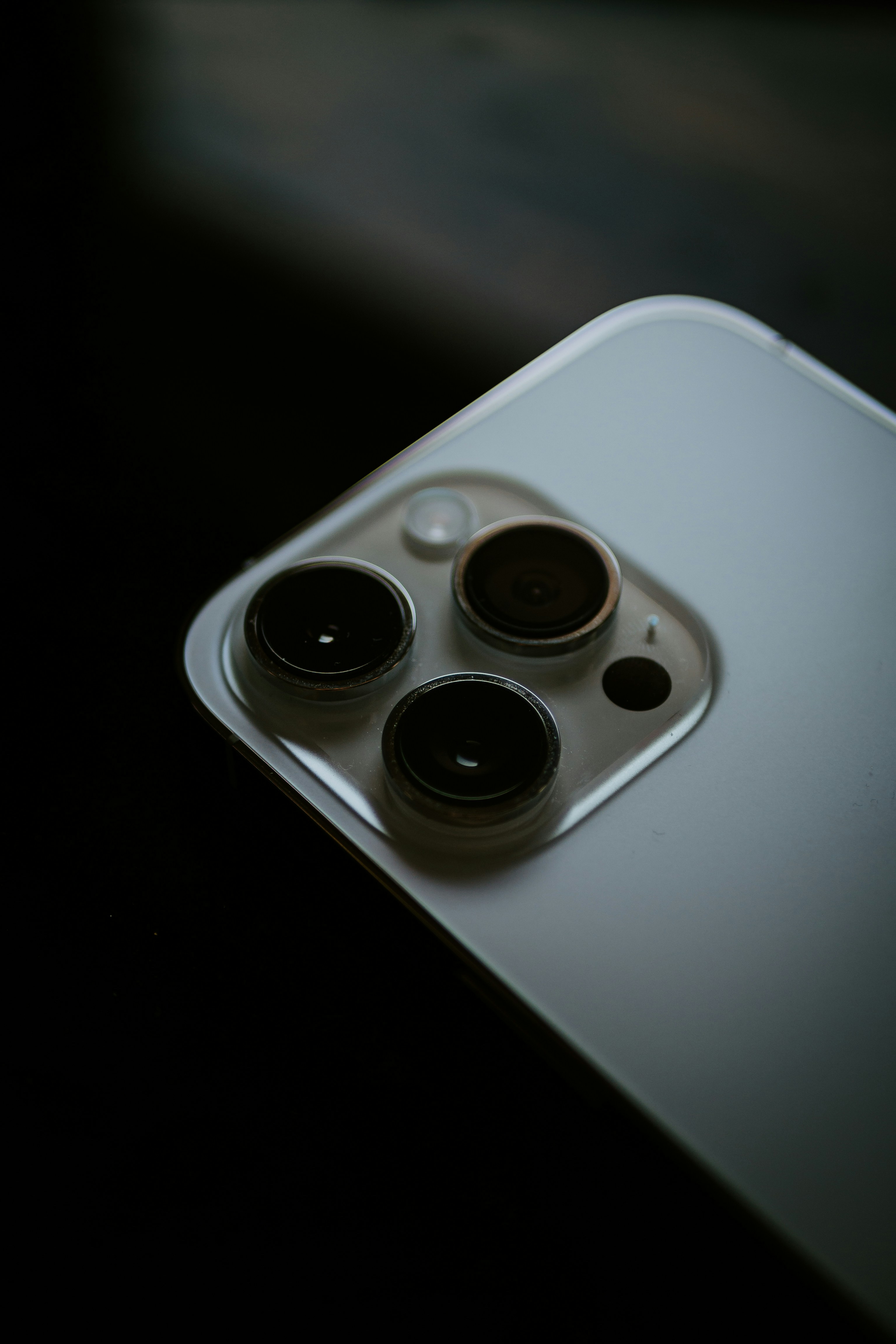 a close up of a cell phone with three buttons