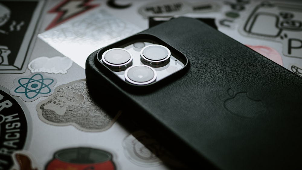 a cell phone case with three buttons on it