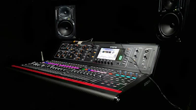 Professional audio speakers and mixing console setup in a modern venue
