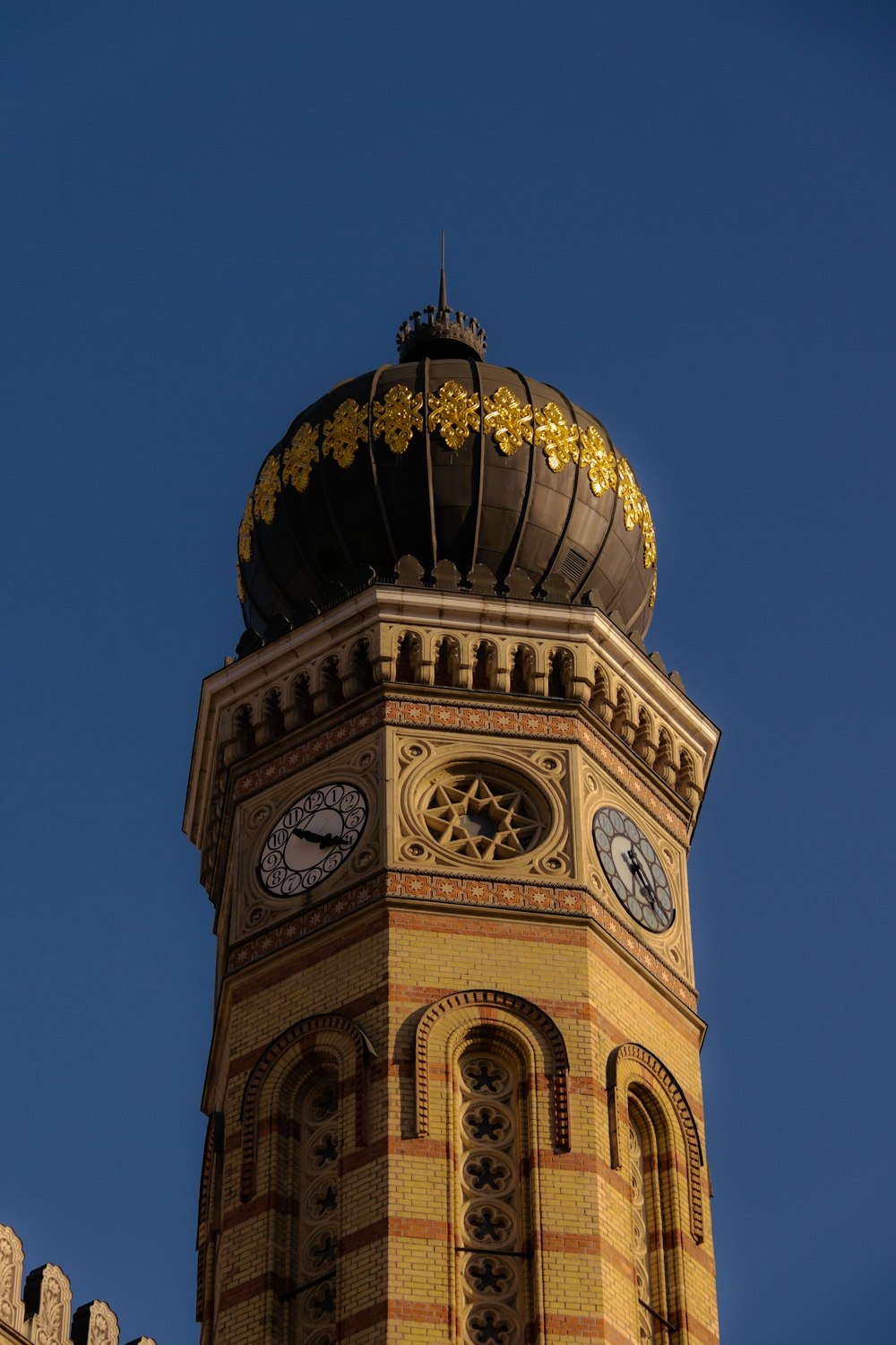 a tall tower with a clock on the top of it