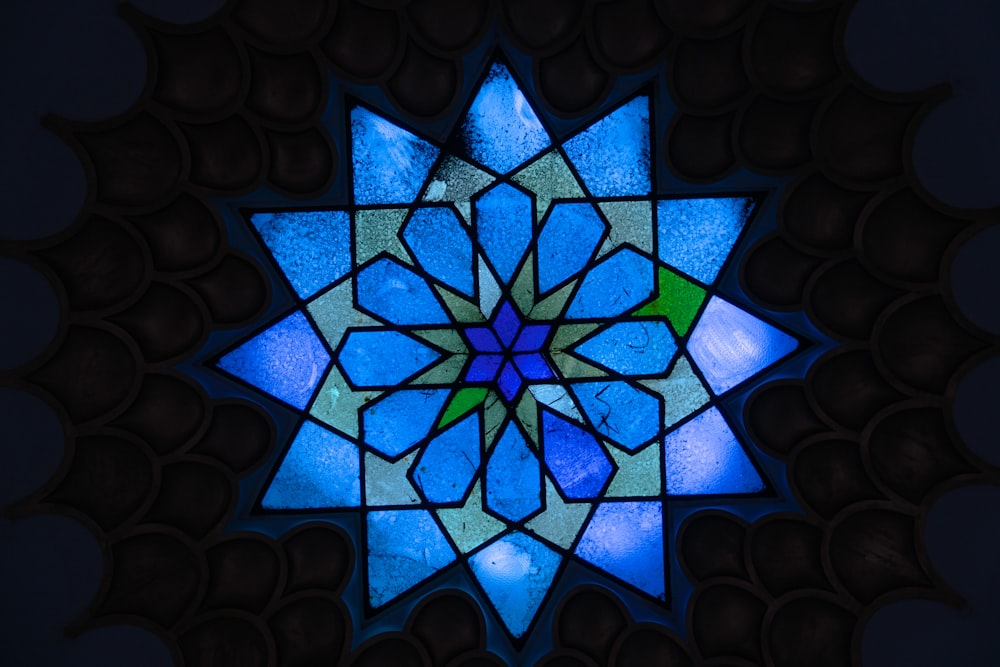 a stained glass window with a star design