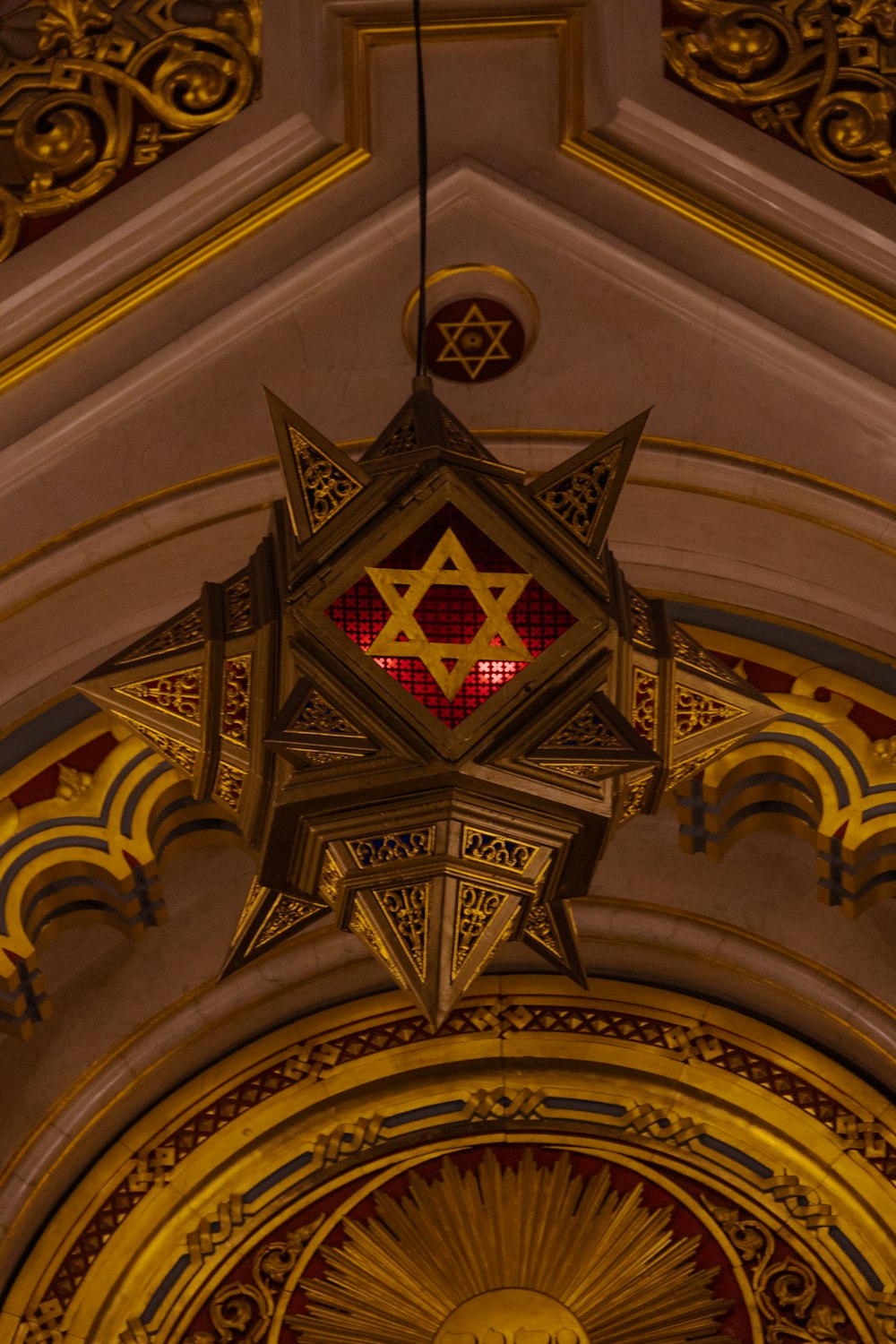 a star of david hanging from the ceiling of a church