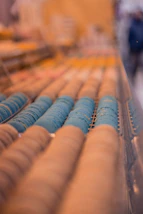 a row of blue and yellow objects on a shelf