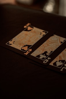 two playing cards sitting on top of a table