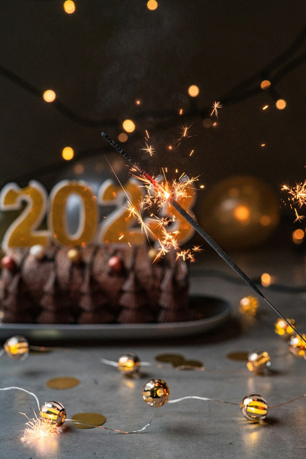 a cake with a sparkler on top of it