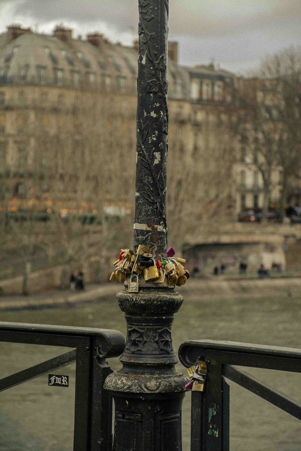 a pole with a bunch of locks attached to it