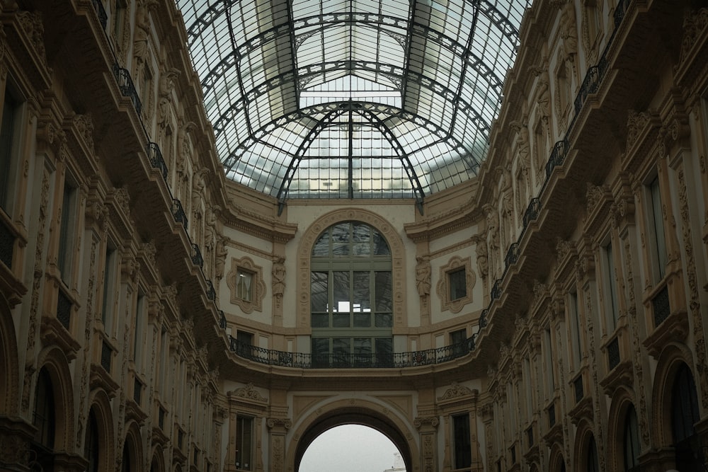 a large building with a glass ceiling and arched windows