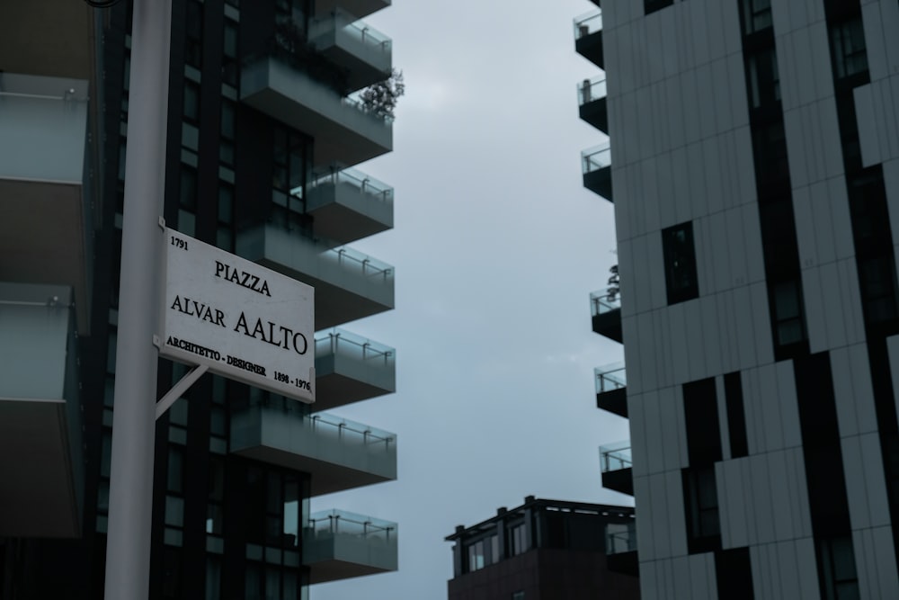 a street sign in front of a tall building