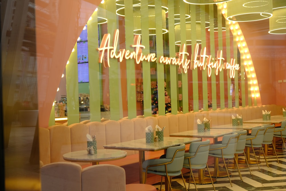 a brightly lit restaurant with chairs and tables