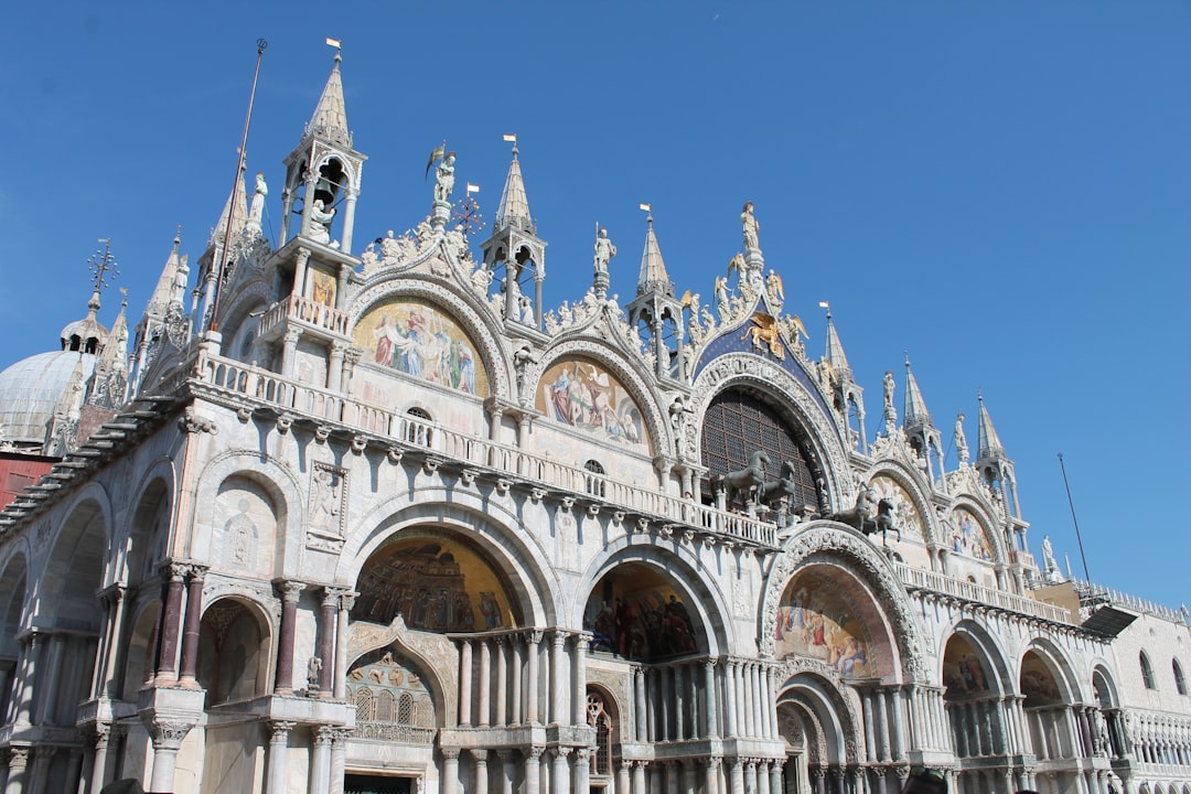 a large building with a clock on the top of it, Venice