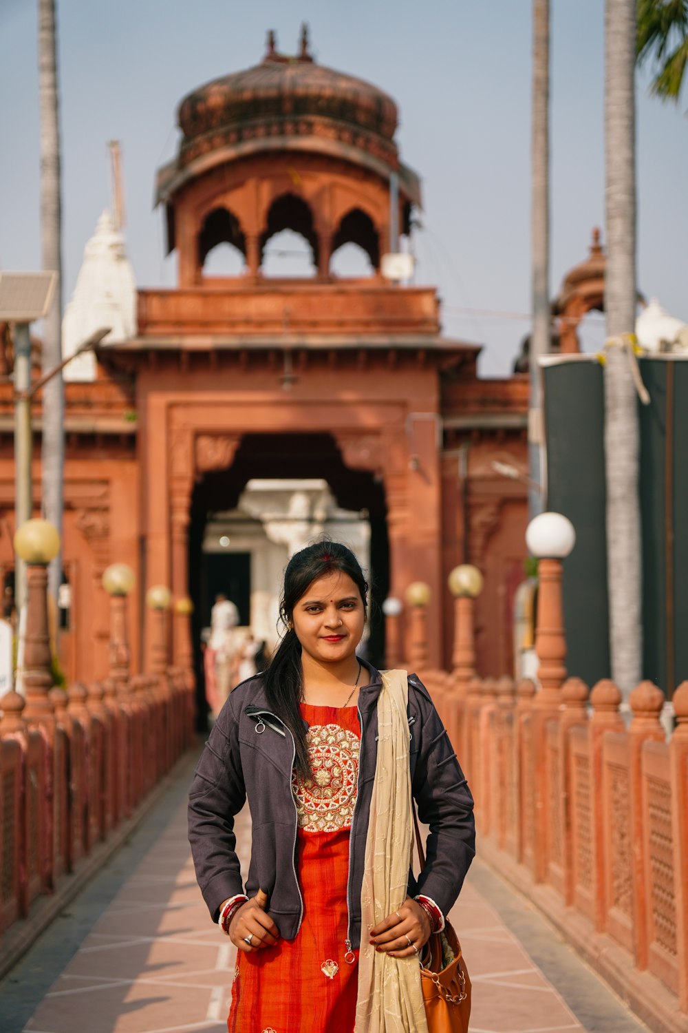 a woman standing in front of a building