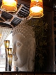 An intimate setting with softly lit sculptures evoking meditation and calm.