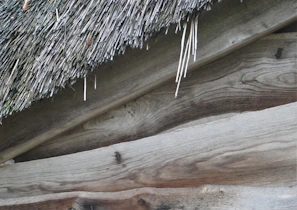 Close-up of the wooden texture and craftsmanship of a wendy house designed to withstand local weather.
