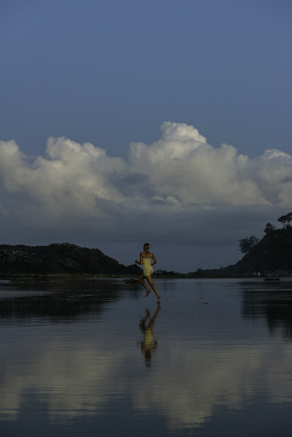 a person standing in the middle of a body of water