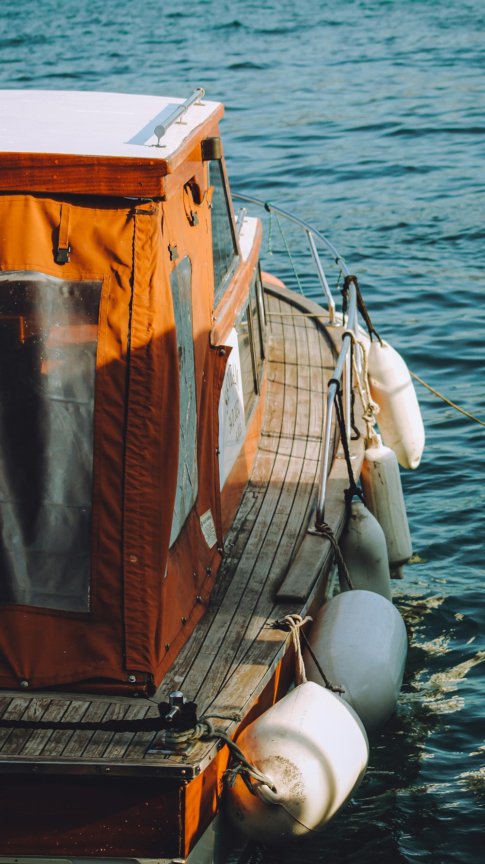 a boat tied up to a dock in the water