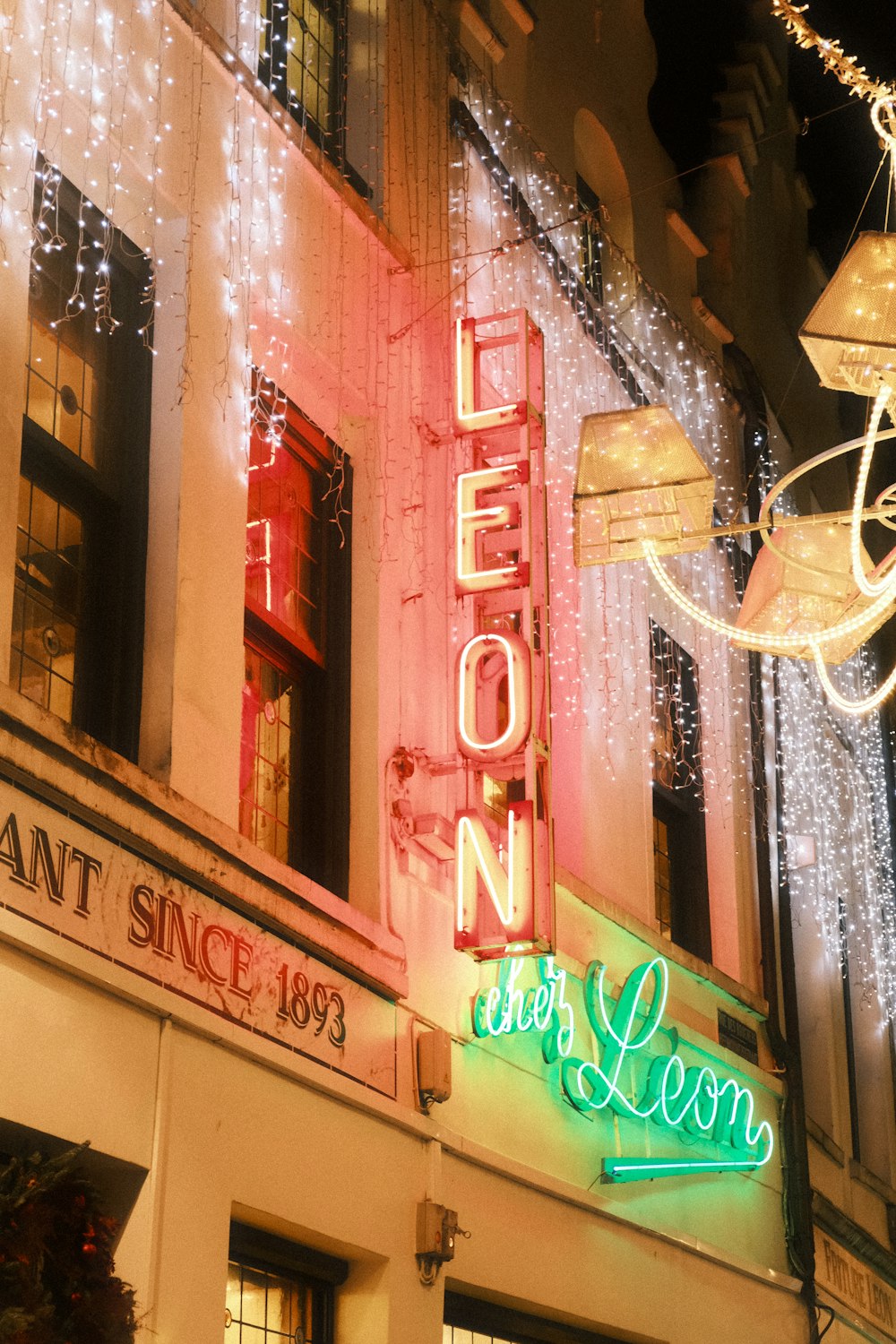 a neon sign on the side of a building