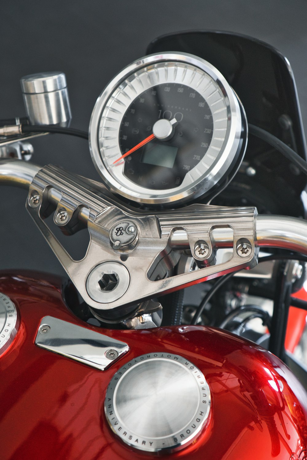 a close up of a motorcycle with a speedometer