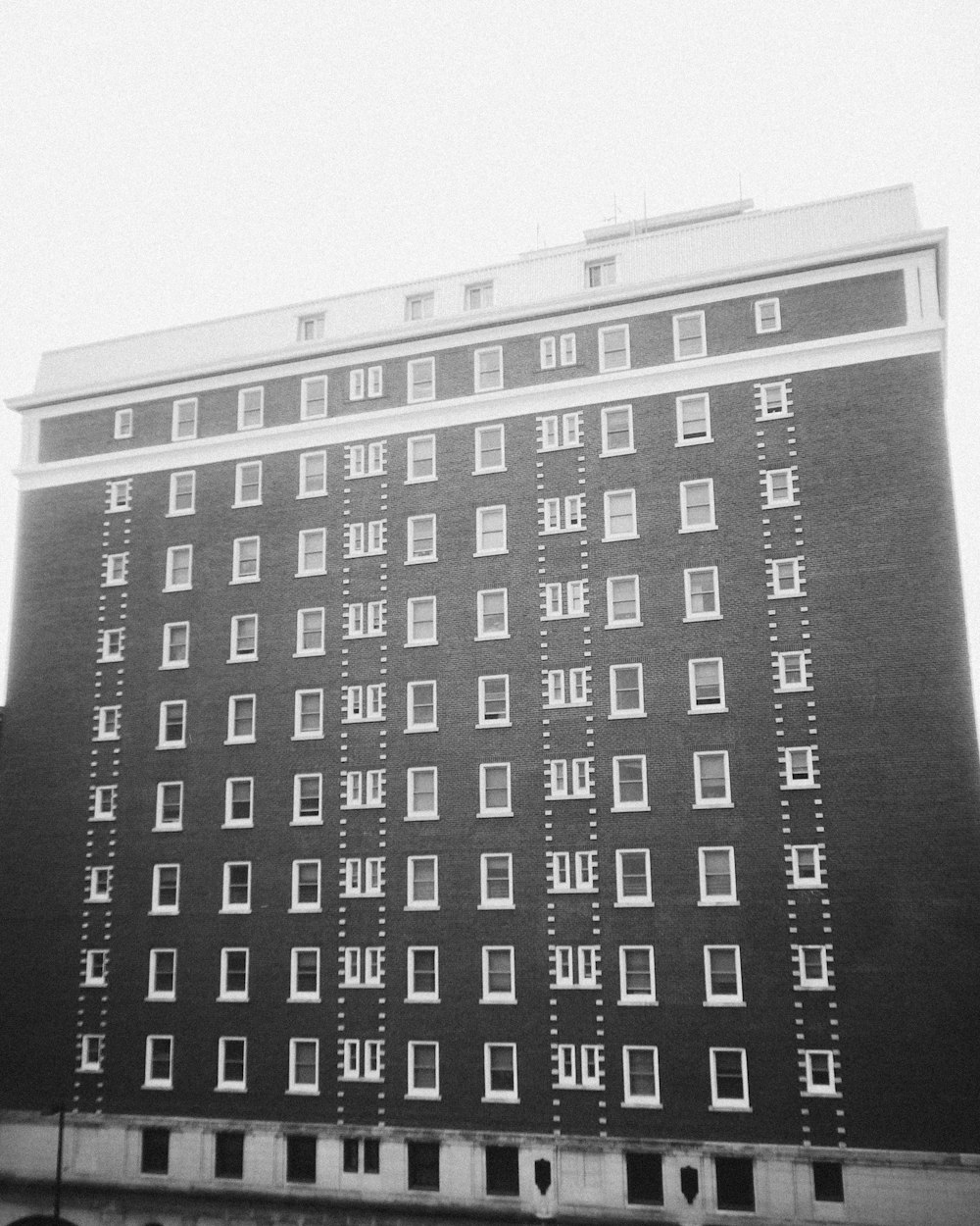 a black and white photo of a tall building