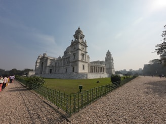 Exterior view of Casa Memorială Ion Creangă with visitors admiring the historic site.