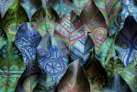 Close-up of colorful hand-drawn leaves and flowers from a nature-inspired storybook.