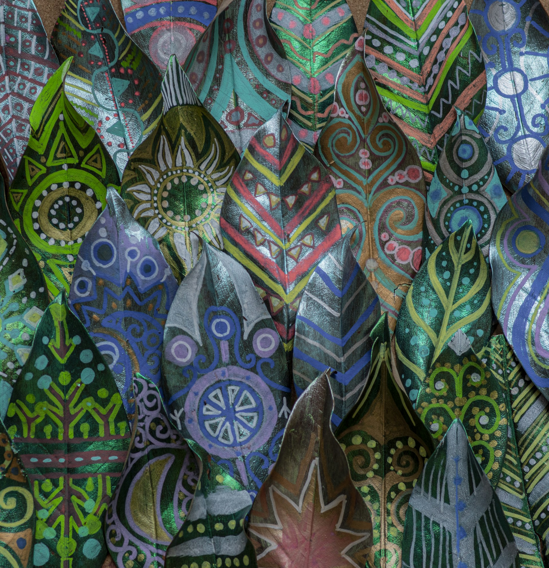 a close up of a bunch of different colored leaves