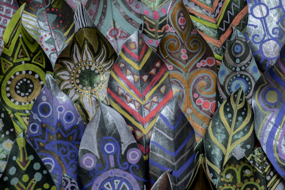 a close up of a bunch of different colored ties