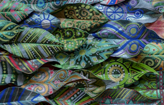 a close up of a pile of colorful cloths