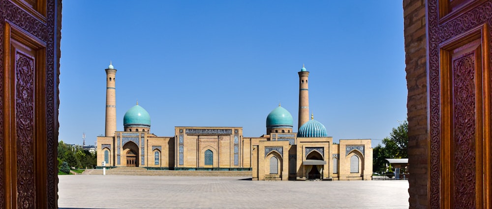 a large building with two blue domes on top of it