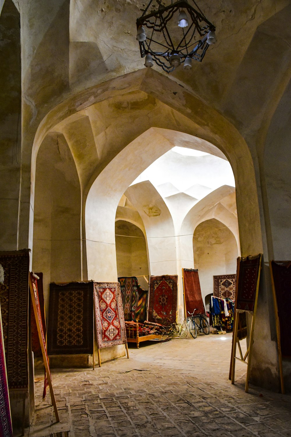 a room filled with lots of carpets and rugs