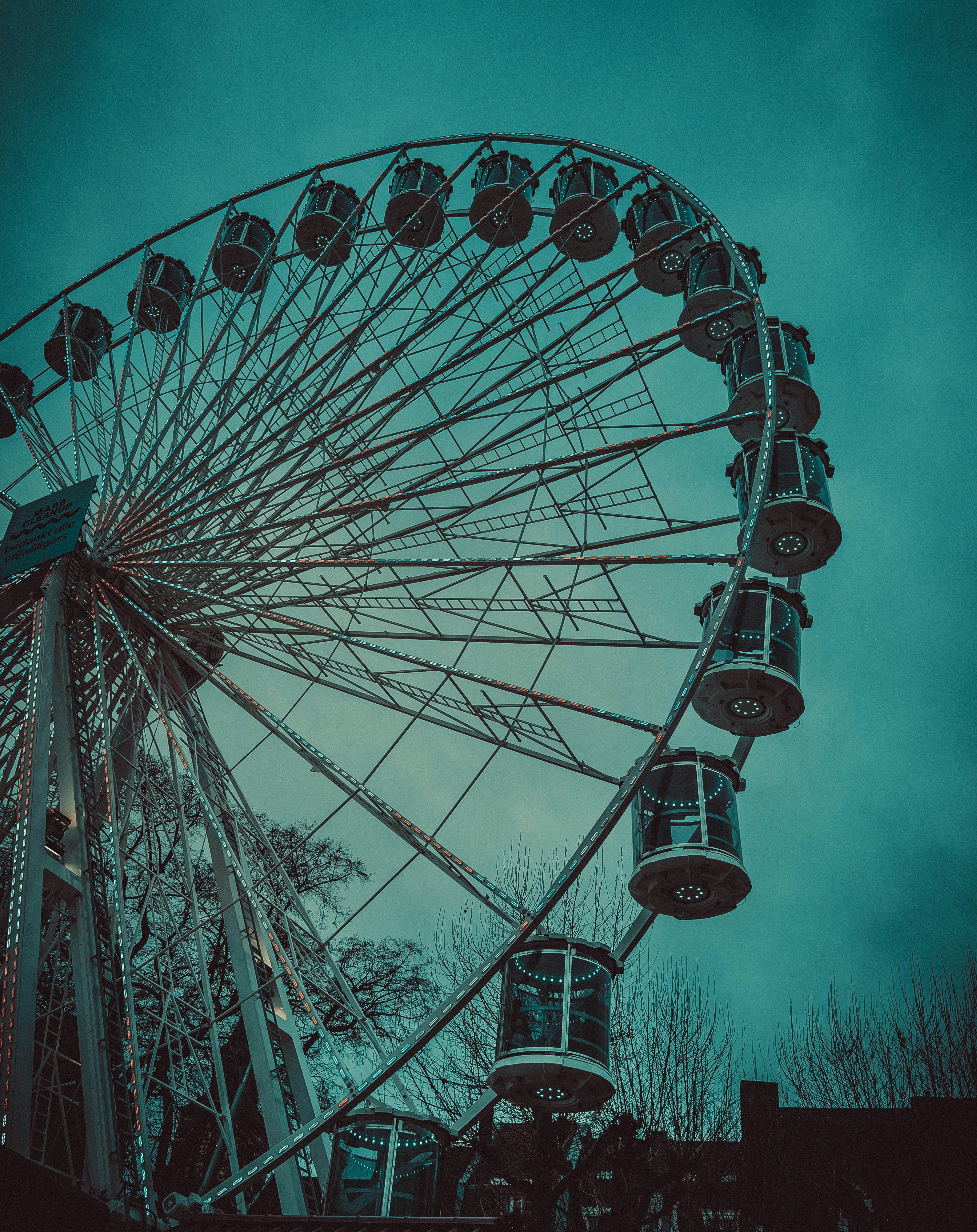 a large ferris wheel on a cloudy day