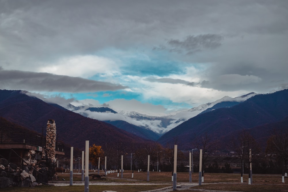 the mountains are covered in snow and clouds