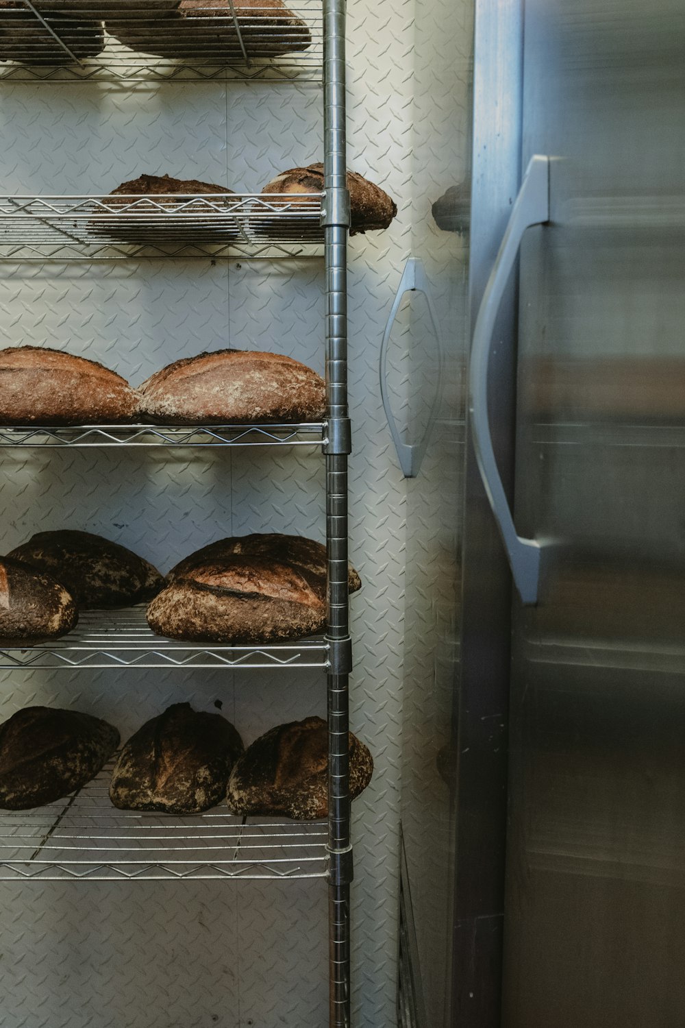 a bunch of breads that are on a rack