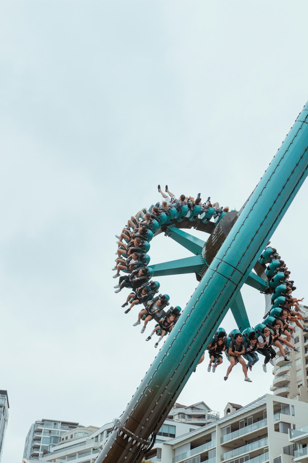 a large group of people riding a roller coaster