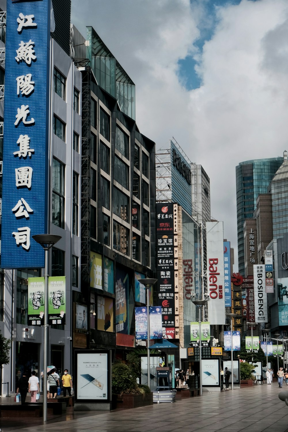 a city street filled with lots of tall buildings