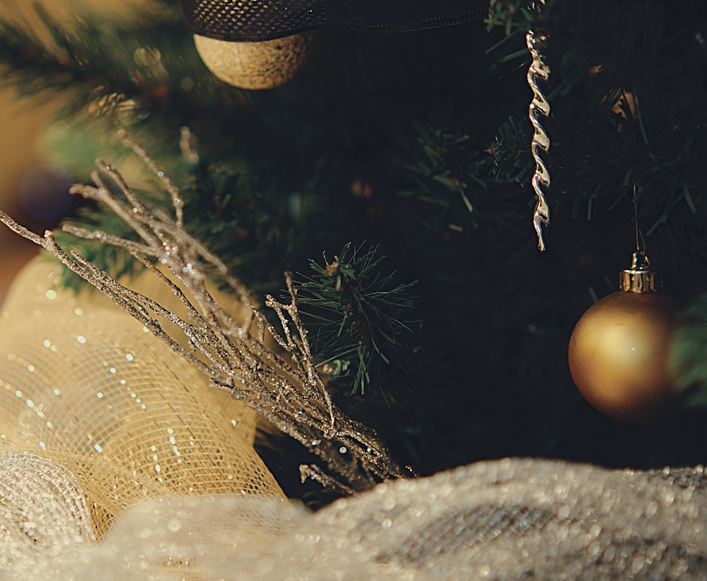 a close up of a christmas tree with ornaments