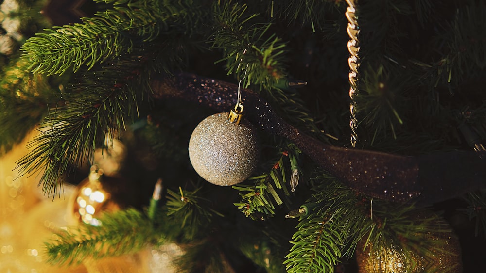 a close up of a christmas tree with ornaments