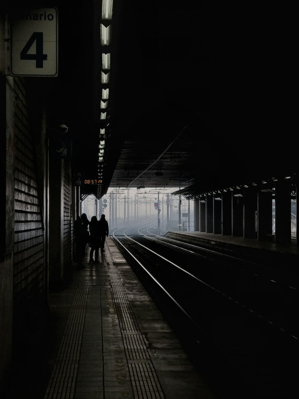 A group of people standing next to a train station photo – Free Italia  Image on Unsplash