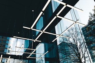 a group of lights hanging from the ceiling of a building