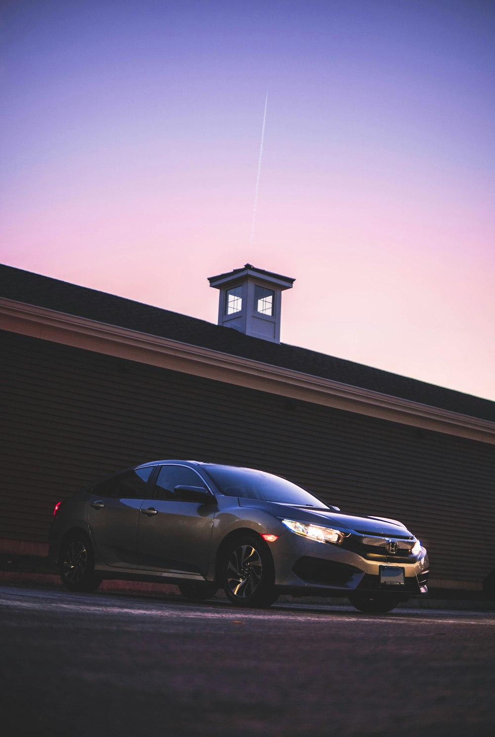 two cars parked in front of a building